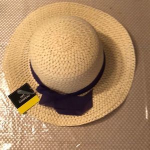 NWT TAN SUNHAT With a purple bow wrapped around it